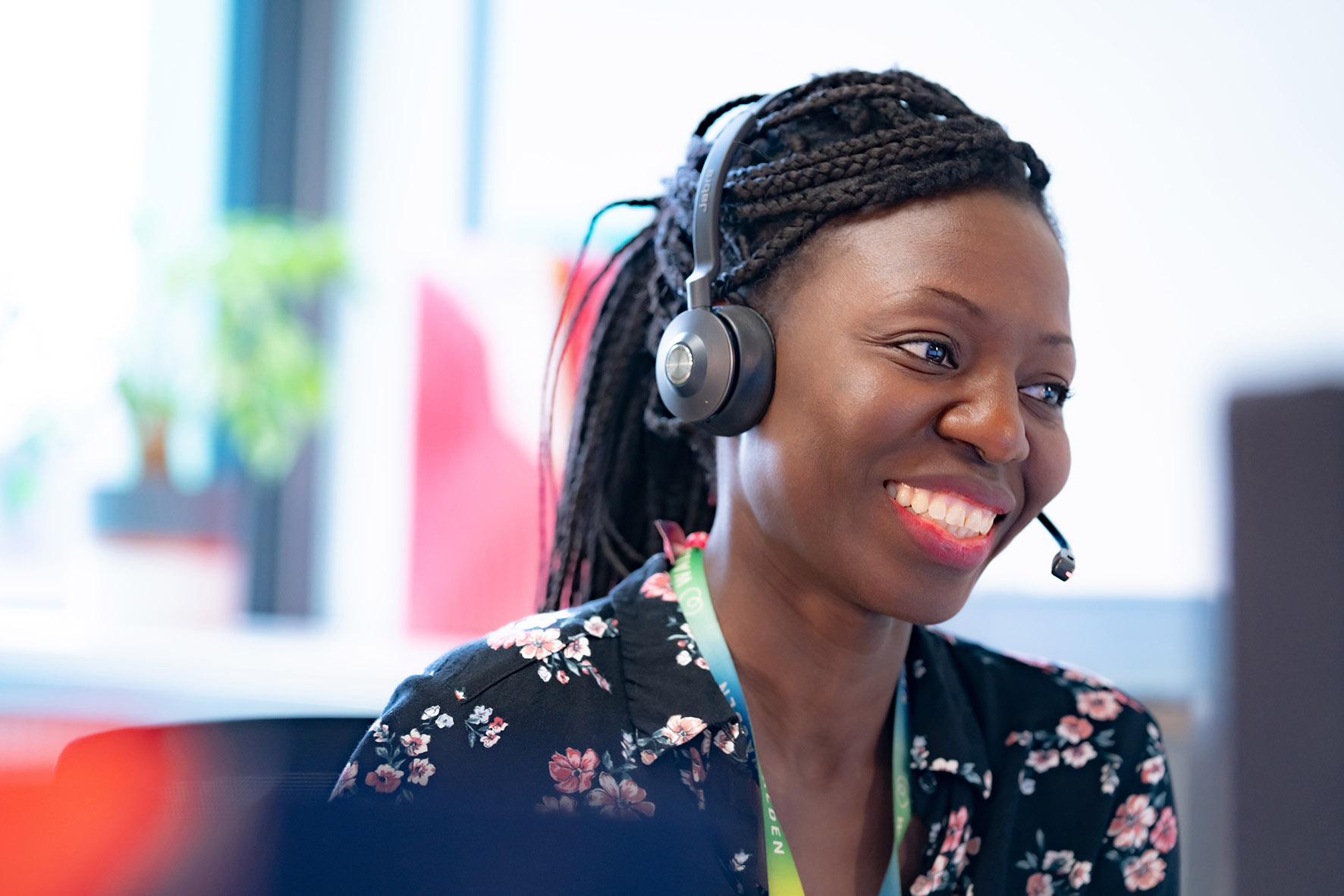 Staff wearing headset and smiling