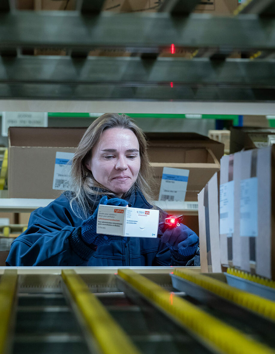 Woman scanning medicine box